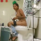A pretty, Hispanic girl is recorded by a hidden camera while she takes a runny shit sitting on a toilet. Vertical format HD video. About 5.5 minutes.